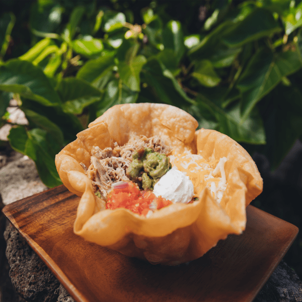 puffy taco with tomato, beef, sour cream